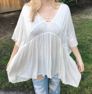 loose white free people top and distressed jeans