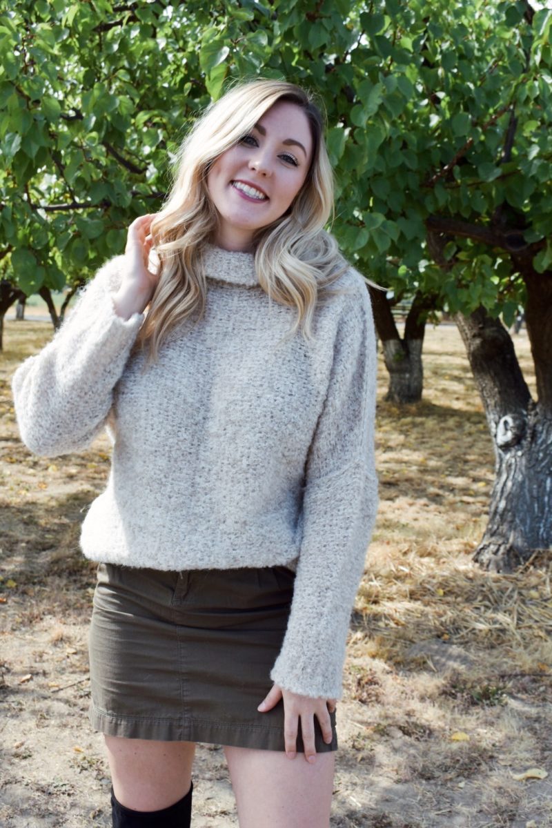 Fall outfit oversized free people sweater with over the knee boots and khaki skirt