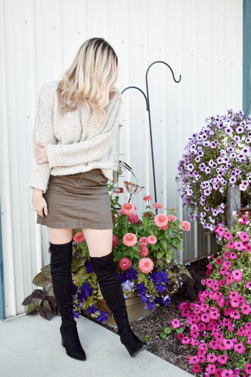 Fall outfit oversized free people sweater with over the knee boots and khaki skirt
