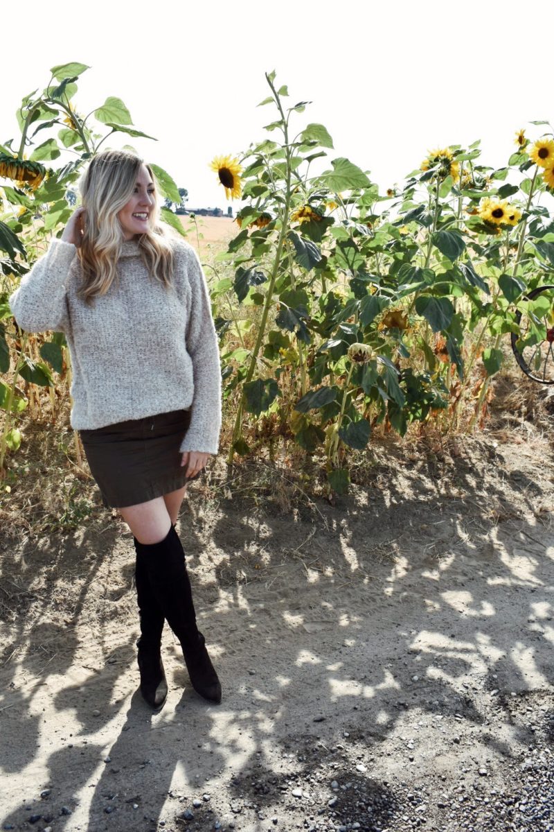 Fall outfit oversized free people sweater with over the knee boots and khaki skirt